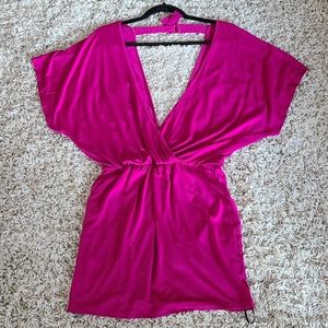 New. Deep cut, open back dress. Size S.